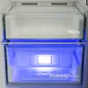 Interior view of a refrigerator with two drawers. The top drawer is labeled 'Dairy' and the bottom drawer is illuminated with blue light and labeled 'HARVESTfresh'. Voir les images du produit