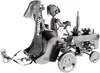 A metal sculpture of a wedding couple on a tractor. Produktbild-Vorschau