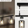 A collage of images showing details of a black pendant lamp with glass shades. Anteprima dell’immagine prodotto