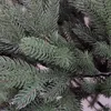 A close-up view of artificial Christmas tree branches. Produktbild-Vorschau