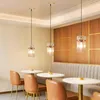 A dining area with pendant lights, tables, and chairs. Anteprima dell’immagine prodotto