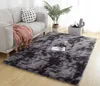 A shaggy rug in a living room setting, with a sofa and plant. Náhled obrázku produktu