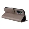 A gray flip phone case with floral and butterfly embossed details, shown open with a phone inside. Produktbild-Vorschau