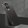 A dark gray smartphone case with a metallic camera module is displayed at an angle, leaning against a dark gray block. The background is a gradient of gray with subtle shadows. Produktbild-Vorschau