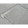 A roll of speckled vinyl wrap is shown, with the pattern appearing to be gray with black flecks. Produktbild-Vorschau