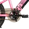 A close-up view of the pedal and chainring assembly of a pink bicycle. Produktbild-Vorschau