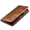 A brown leather flip case for a smartphone, shown from a diagonal angle with the phone partially visible inside. Produktbild-Vorschau