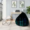 A modern living room with a bean bag chair, coffee table, and desk. Voir les images du produit