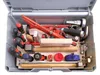 An open toolbox filled with various tools, including screwdrivers, hammers, and other installation equipment. Produktbild-Vorschau