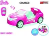 A pink Barbie car with green glowing interior and a remote control, presented on a white background with text overlays and logos. Náhled obrázku produktu