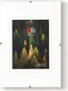 A white frame with a picture of a forest inside. Produktbild-Vorschau