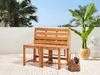 A wooden garden bench and two stools are set up on a tiled patio with palm trees and a potted plant in the background. Produktbild-Vorschau
