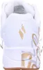 The back view of a white SKECHERS sneaker with gold metallic accents. Anteprima dell’immagine prodotto