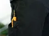 A close-up shot of a black pocket with an orange and black marker inside. Produktbild-Vorschau
