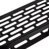A close-up view of a black metal shower shelf with a perforated surface. Produktbild-Vorschau