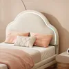 A close-up shot of a bed with a cloud-shaped headboard featuring LED lights. Produktbild-Vorschau
