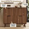 A retro-style flip-door shoe cabinet with fluted wooden doors and tapered legs, displayed in a room setting with decorative items on top. Anteprima dell’immagine prodotto