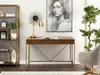 A home office setup with a desk, chair, bookshelf, and artwork. Voir les images du produit
