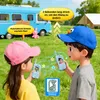 Two children are playing with walkie-talkies outdoors, with a camper van and a tent in the background. Produktbild-Vorschau