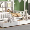 A children's bed with storage drawers and a bookshelf, decorated with stuffed animals and a giraffe figure. Náhľad obrázku produktu
