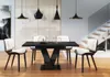 A modern dining room with a black glossy table and chairs, set against a neutral background with a staircase. Anteprima dell’immagine prodotto