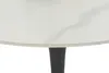 A close-up view of the edge of a round table with a white marble-patterned top and a black pedestal base. Produktbild-Vorschau