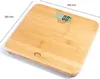 A digital scale with a bamboo surface is shown from a slightly elevated angle against a white background. Produktbild-Vorschau