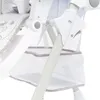 Close-up view of a baby high chair with a storage basket. Produktbild-Vorschau