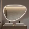 A modern bathroom with a large, organically shaped mirror with LED lighting above two sinks. Anteprima dell’immagine prodotto