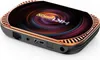 A black and gold smart TV box with a colorful, swirling design on top. Náhled obrázku produktu
