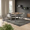 A dining set with a table and chairs in a modern living room setting. Anteprima dell’immagine prodotto