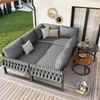 An outdoor patio or balcony setting with a sectional sofa and side tables. Produktbild-Vorschau