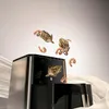 A WMF Multitaste air fryer with grilled shrimp and artichokes seemingly floating out of it, with draped fabric in the foreground and background. Produktbild-Vorschau