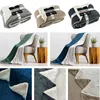 A collage of different colored blankets, some folded and some draped over chairs. Produktbild-Vorschau