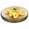A stack of plates with tortellini on the top plate. Produktbild-Vorschau