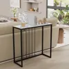 A console table with decorative items placed on it, situated in a living room setting next to a sofa. Produktbild-Vorschau