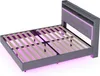 A grey upholstered bed frame with a headboard, shown from a diagonal angle with the mattress support slats visible. Pink LED lights are illuminating the underside of the bed and the headboard. Náhľad obrázku produktu