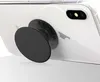 A black PopSocket is attached to the back of a white smartphone. Produktbild-Vorschau