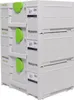 A stack of white toolboxes with green handles. Podgląd zdjęcia produktu