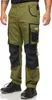 A person wearing green cargo pants with black accents and black work boots. Produktbild-Vorschau