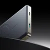 A close-up, angled view of a power bank against a dark, gradient background. Produktbild-Vorschau