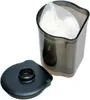 A black lid is placed next to a clear plastic container holding a white mesh bag filled with white granular material. Anteprima dell’immagine prodotto