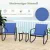 A patio set with two rocking chairs and a small table on a wooden deck with a railing and the ocean in the background. Anteprima dell’immagine prodotto