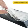 A close-up shot of a hand inserting money into a clear plastic pocket of a black album. Produktbild-Vorschau