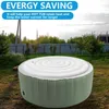 An inflatable hot tub cover is shown outdoors on a grassy lawn, with a fence and trees in the background. Podgląd zdjęcia produktu
