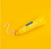 A yellow tube of toothpaste with a swirl of toothpaste on a yellow background. Anteprima dell’immagine prodotto