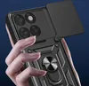 A hand holding a black phone case with a camera cover and a ring holder. Produktbild-Vorschau