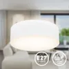 A white fabric ceiling light in a modern living room. Produktbild-Vorschau