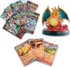 A collection of Pokémon trading card packs, trading cards, and a Charizard figurine. Produktbild-Vorschau