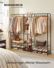 A SONGMICS open wardrobe rack with clothes and shoes, set up in a room. Produktbild-Vorschau